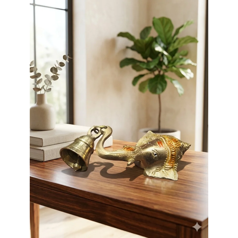 A beautifully crafted Brass Lord Ganesha Wall Hanging with Bell, designed to bring positivity, protection, and spiritual charm to your entrance or temple space.